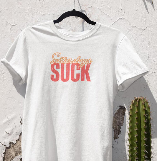 Saturdays SUCK Unisex Heavy Cotton Tee, Weekend Humor Graphic T-Shirt, Casual Tee, Relaxation Clothing, Gift for Him, Her, Unisex Tee Gift